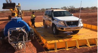 Explore portable wash bays for environmental compliance and spill control Portable wash bay system for on-site vehicle and equipment cleaning