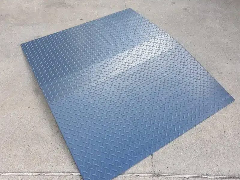 Heavy-duty steel bunding ramp providing smooth vehicle access over containment areas.