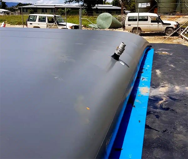 Dewatering bag connected to pump discharge hose for sediment filtration