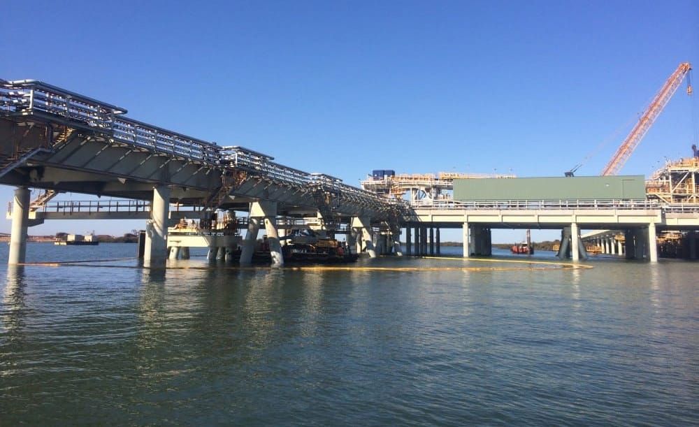 Floating containment boom deployed on a waterway for spill containment