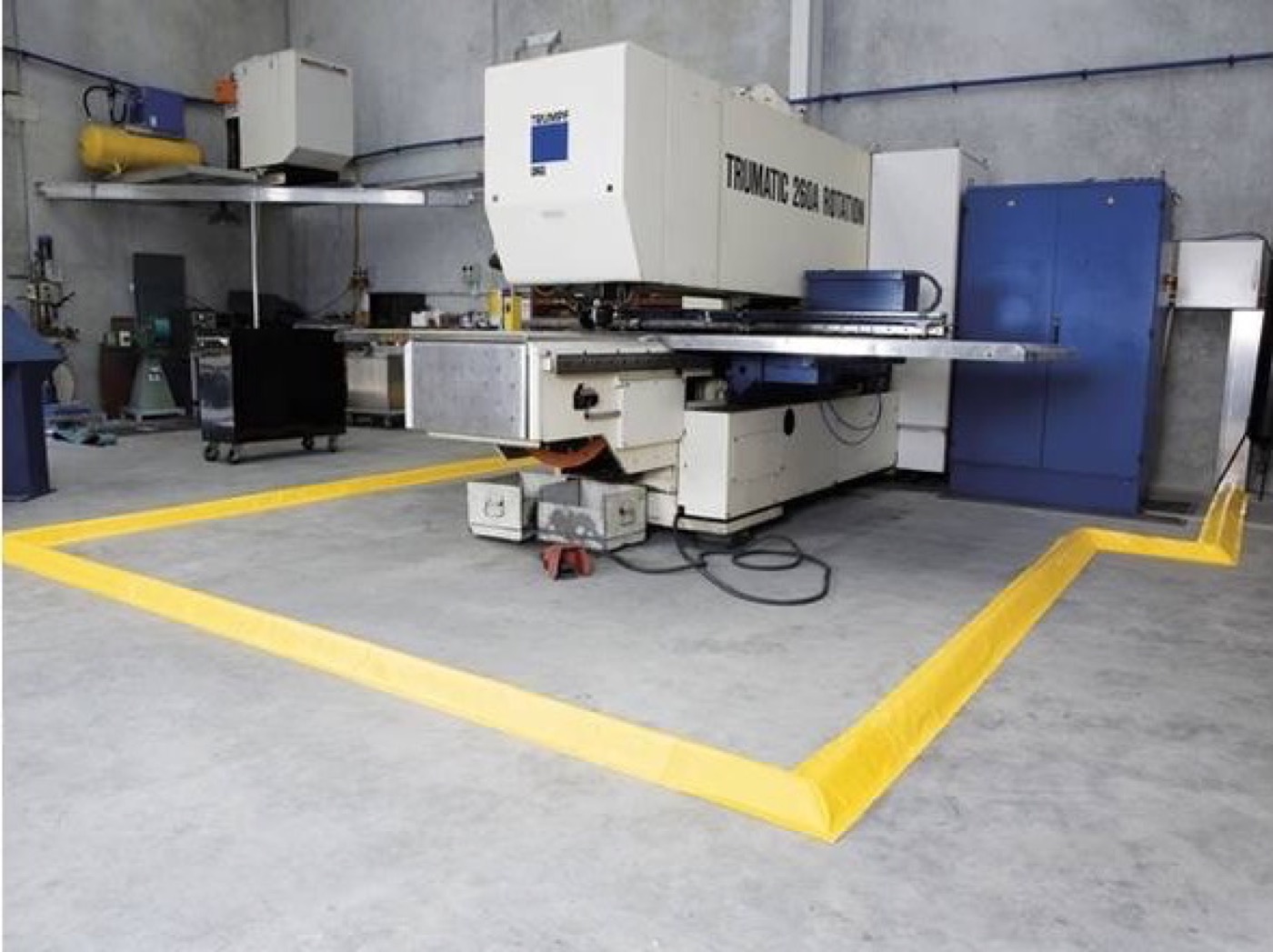 100 mm flexible floor bunding installed around workshop machinery