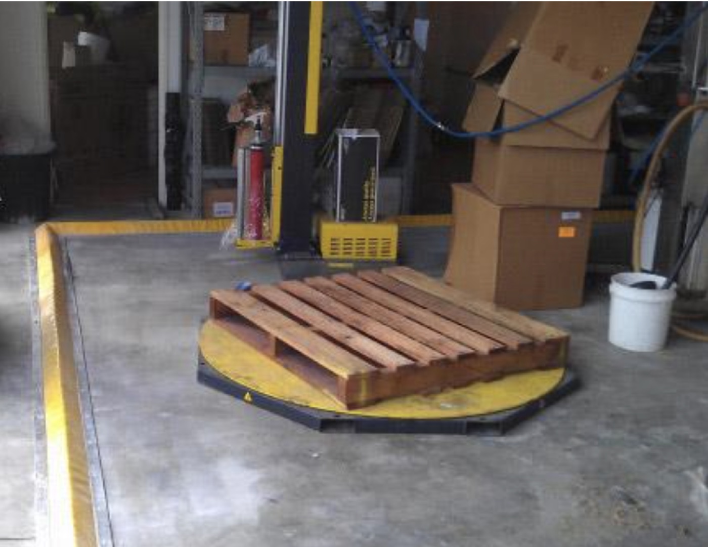 Flexible floor bunding installed around a warehouse work area